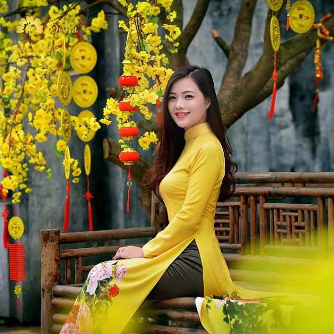 Cách tạo dáng chụp ảnh áo dài Tết du xuân nên thể hiện sự vui vẻ, phấn khởi